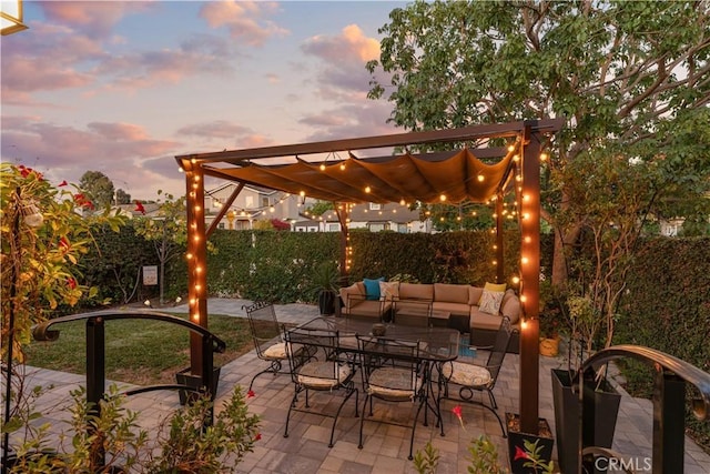 patio terrace at dusk with an outdoor hangout area