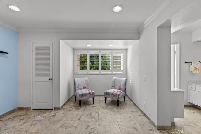 sitting room featuring ornamental molding