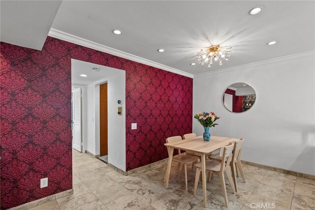 dining area featuring crown molding and a chandelier