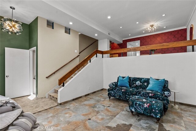 living room with ornamental molding and an inviting chandelier