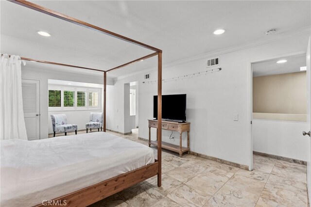 bedroom featuring crown molding