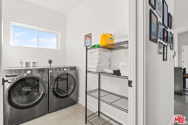 clothes washing area featuring washing machine and dryer