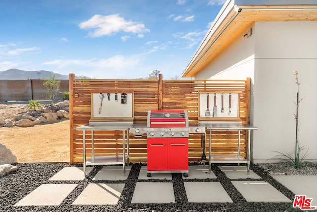 view of patio / terrace with a mountain view