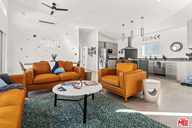 living room with vaulted ceiling, sink, and ceiling fan