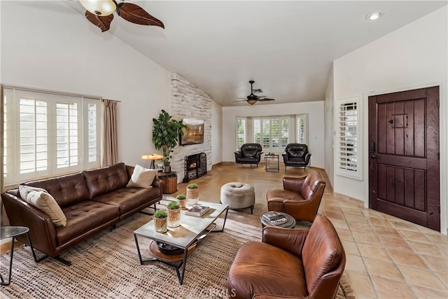 living room featuring high vaulted ceiling and a fireplace