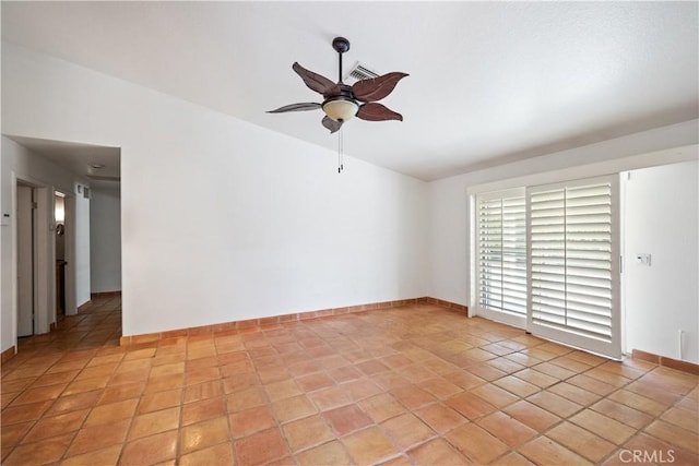 tiled empty room with ceiling fan