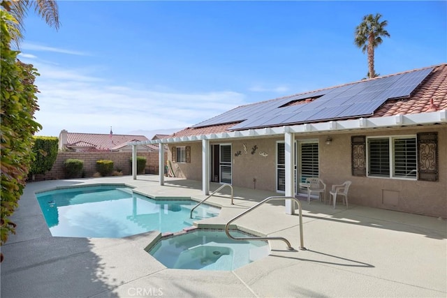 view of swimming pool with a patio and an in ground hot tub