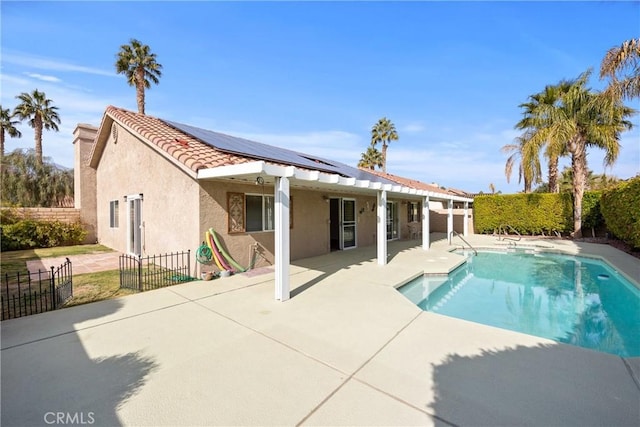 view of swimming pool with a patio