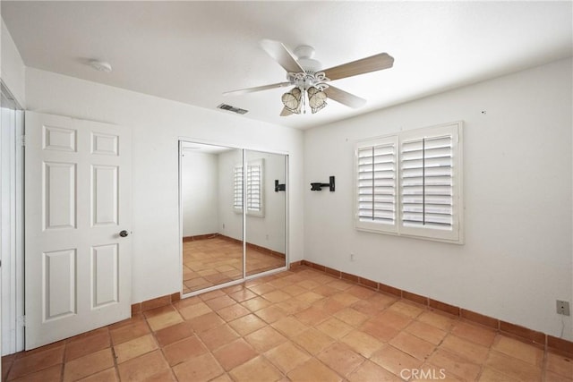 unfurnished bedroom featuring a closet and ceiling fan