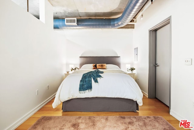 bedroom featuring hardwood / wood-style floors