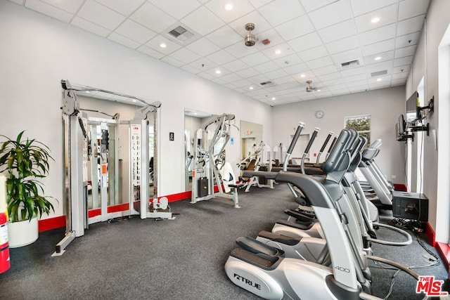 workout area featuring a paneled ceiling