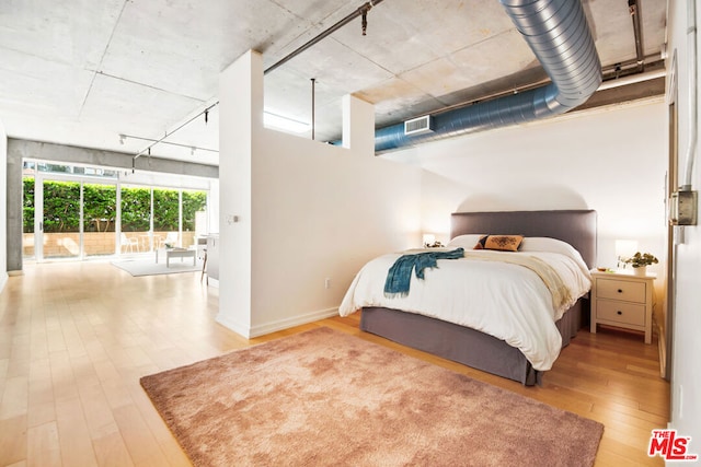 bedroom featuring hardwood / wood-style flooring