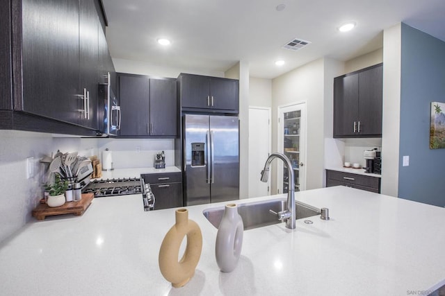 kitchen with sink, kitchen peninsula, and stainless steel appliances