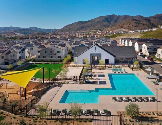 view of pool with a mountain view and a patio area