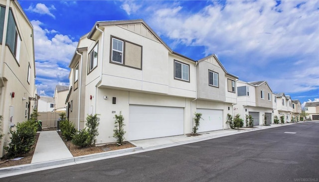 multi unit property featuring a garage