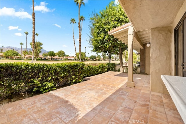 view of patio / terrace with a mountain view