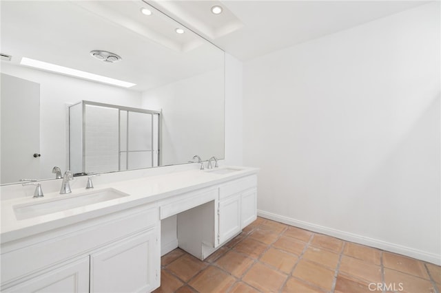 bathroom with vanity and an enclosed shower