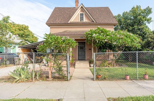 view of front of home with a carport