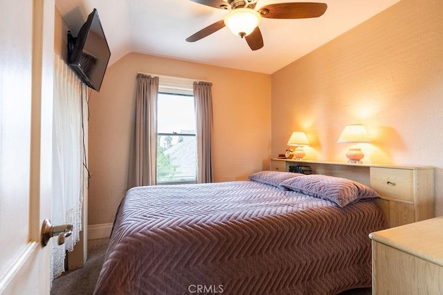 carpeted bedroom featuring ceiling fan and lofted ceiling