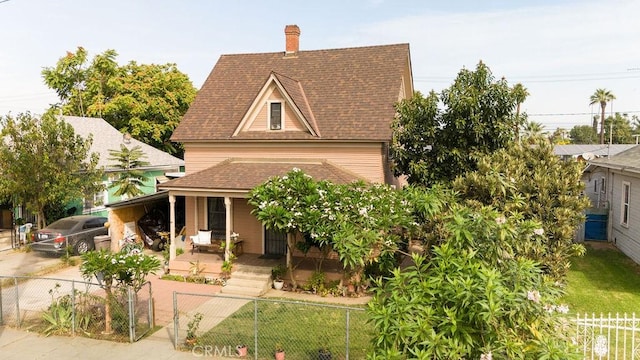 view of front of home featuring a carport