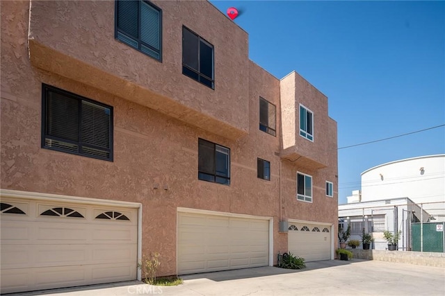 view of building exterior featuring a garage