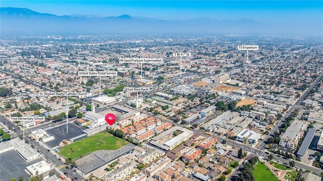 birds eye view of property with a mountain view