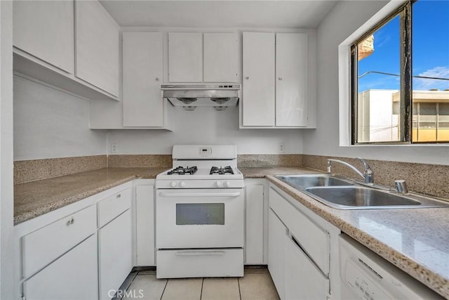 kitchen with sink, white appliances, and white cabinets