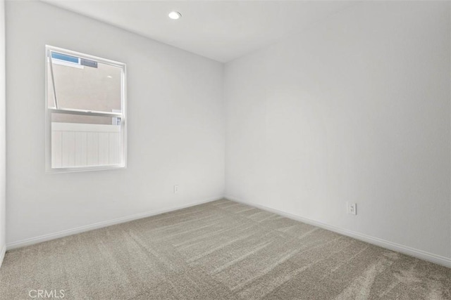 unfurnished room featuring carpet floors