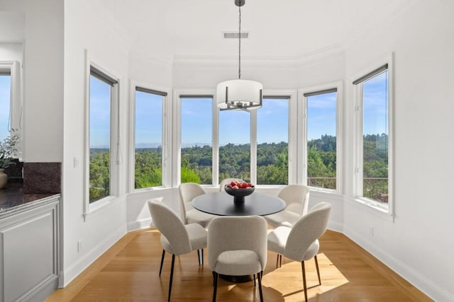 sunroom / solarium with an inviting chandelier and plenty of natural light