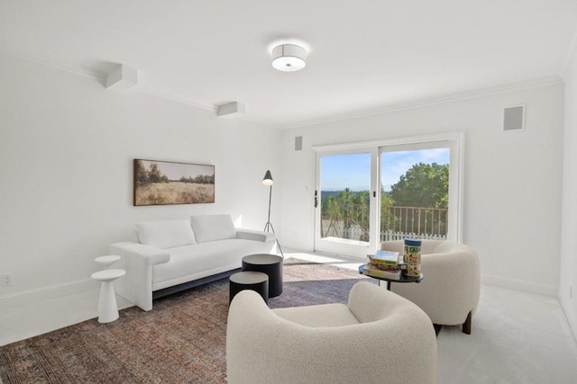 living room featuring crown molding and carpet flooring