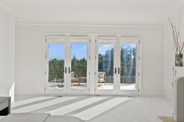 doorway to outside featuring light carpet, ornamental molding, and french doors