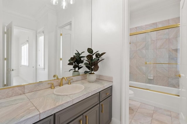 full bathroom featuring enclosed tub / shower combo, tile patterned flooring, vanity, ornamental molding, and toilet