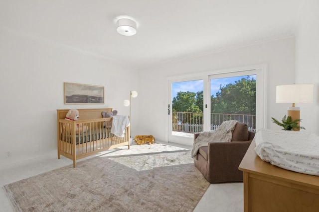 carpeted bedroom featuring crown molding and access to outside