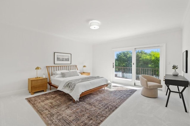 bedroom with carpet floors, access to outside, and ornamental molding