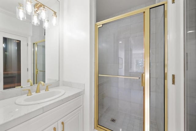 bathroom with vanity and a shower with door