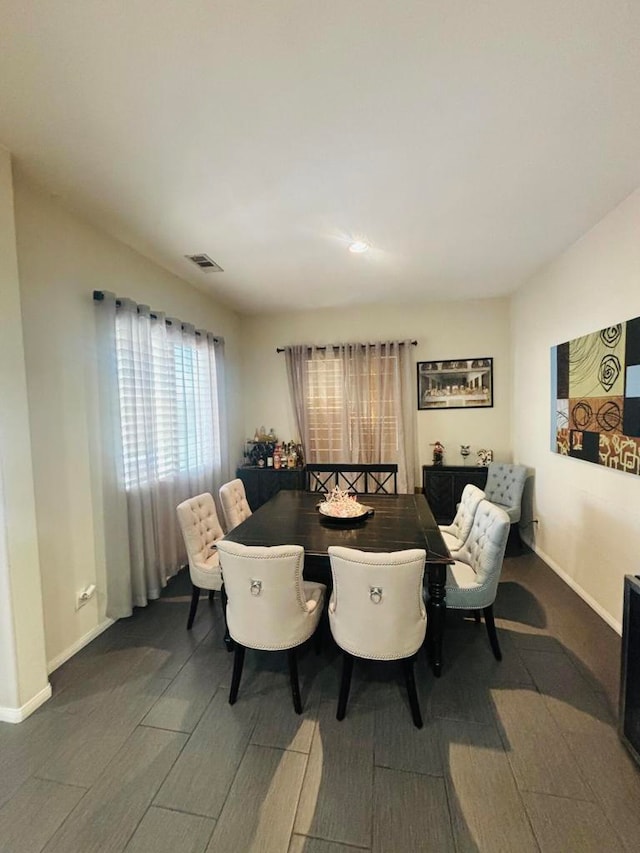 dining space featuring dark hardwood / wood-style floors