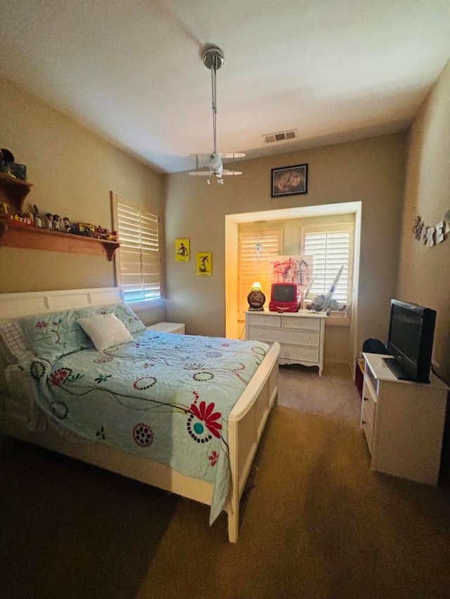 carpeted bedroom with ceiling fan