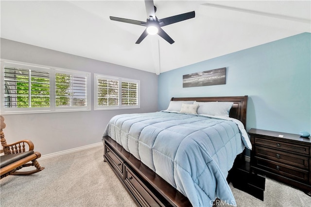 bedroom featuring lofted ceiling, ceiling fan, and light colored carpet