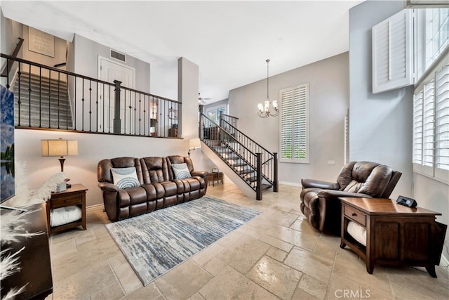 living room with a notable chandelier