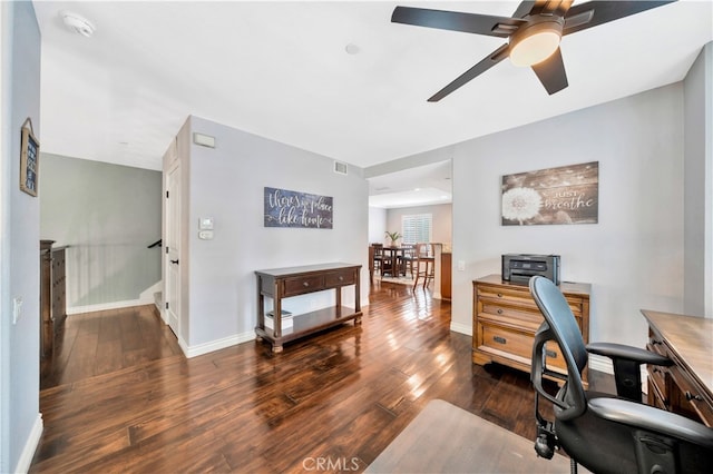 office space with ceiling fan and dark hardwood / wood-style flooring