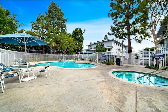 view of swimming pool featuring a patio area