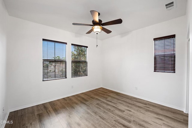 empty room featuring ceiling fan and wood-type flooring