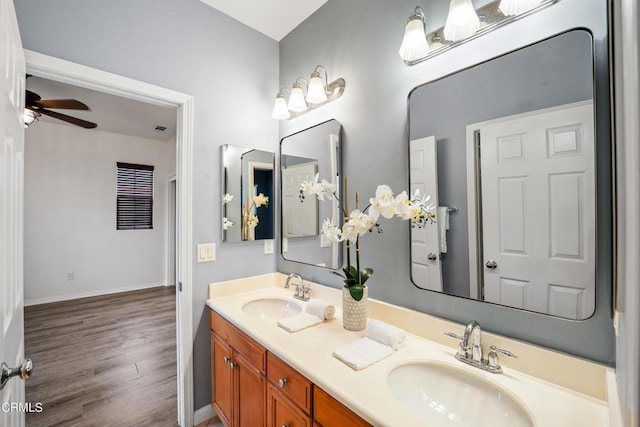 bathroom with vanity, hardwood / wood-style flooring, and ceiling fan