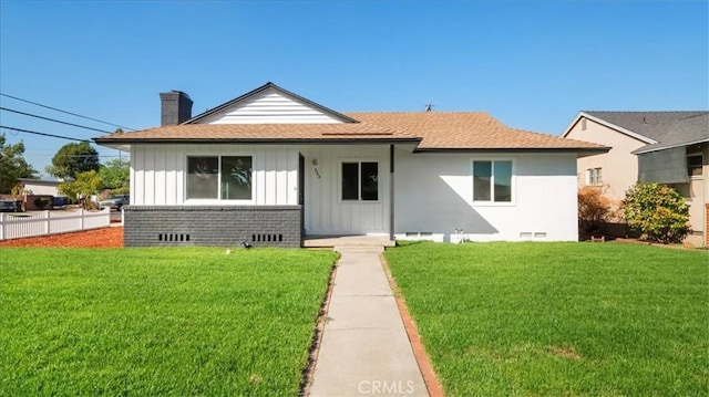 bungalow-style house with a front yard