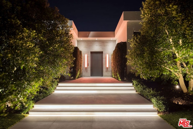 exterior entry at night with elevator