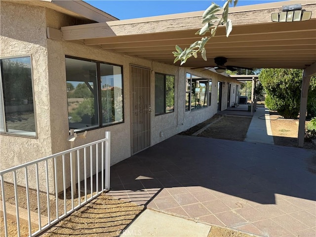 view of patio with ceiling fan