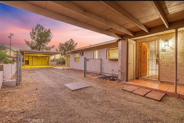 yard at dusk with a storage unit