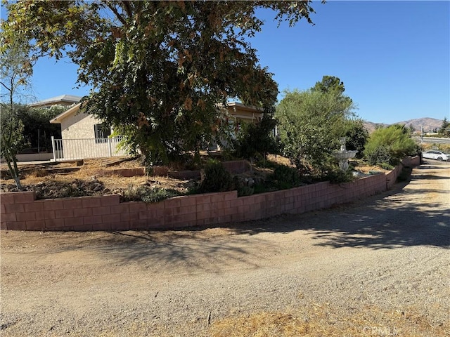 view of side of home featuring a mountain view