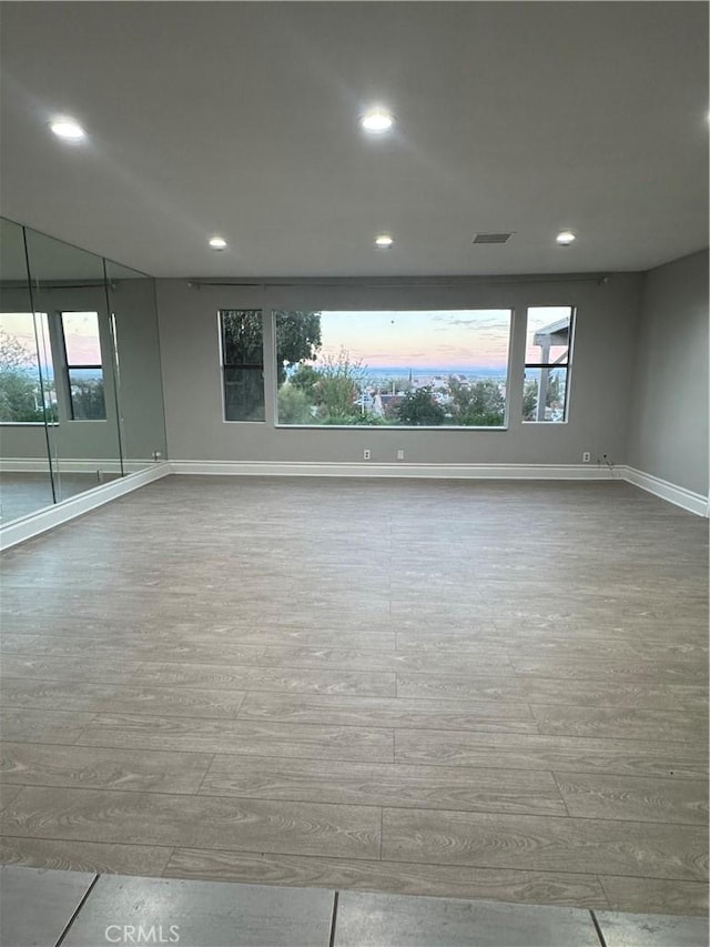 empty room with light hardwood / wood-style floors