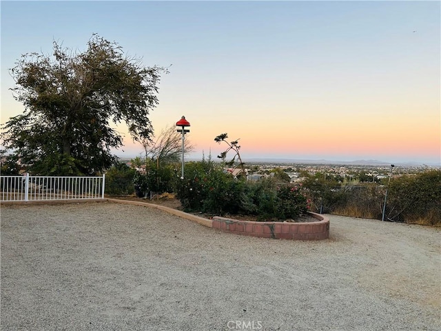 view of yard at dusk